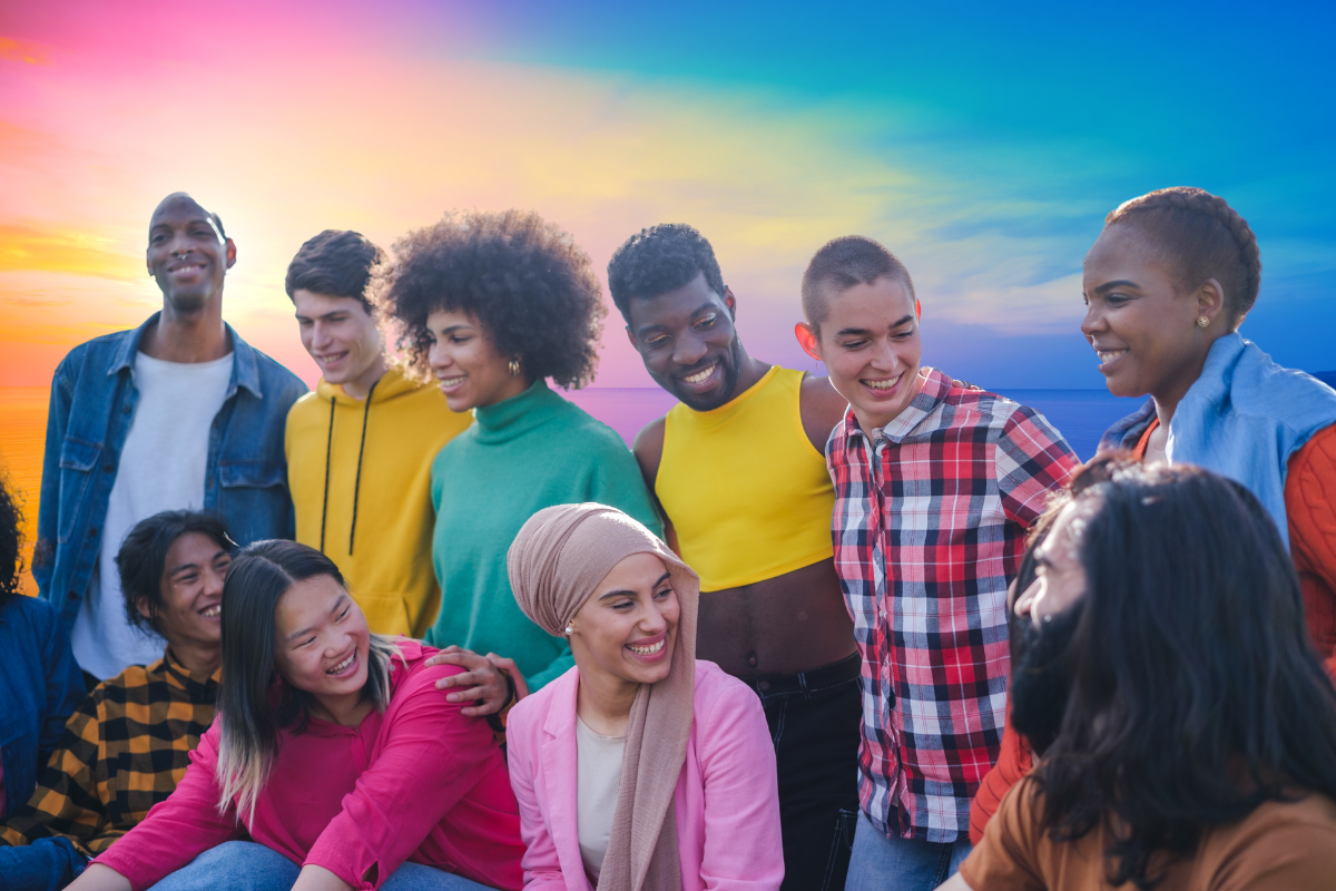 group of diverse people behind colorful sunset