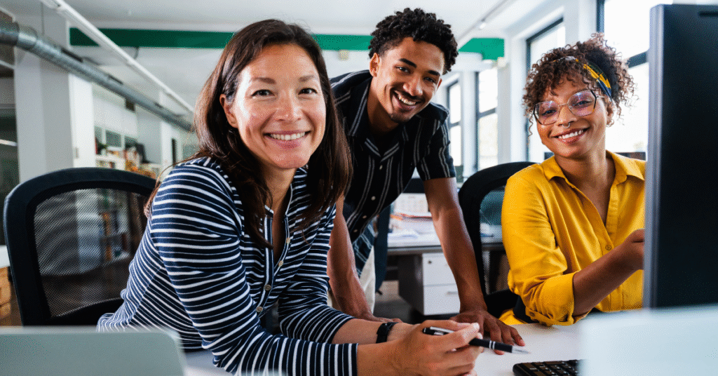 Diverse web design team collaborating with a client on website strategy and user experience